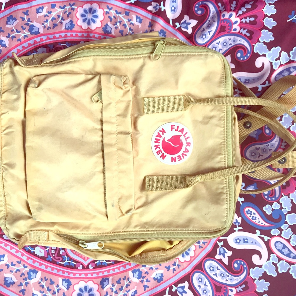 Fjallraven Kanken mustard yellow backpack